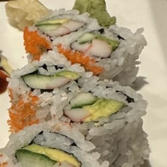 California Roll, Avocado, cucumber, crab stick, fish egg on top.