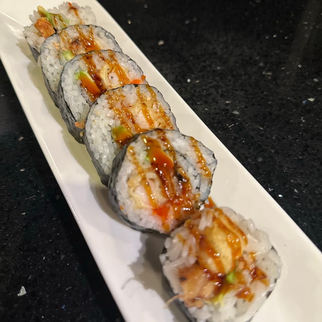 Inaka Roll, Tempura shrimp, avocado, eel and fish egg.