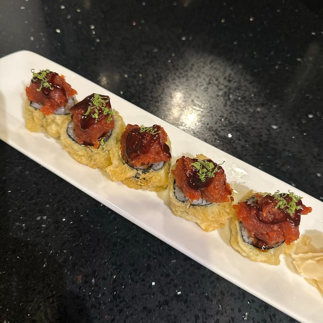 G.C. Tuna Roll, Tempura rice cake, spicy tuna on top.